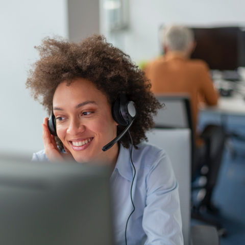 Woman with a headset answering a call