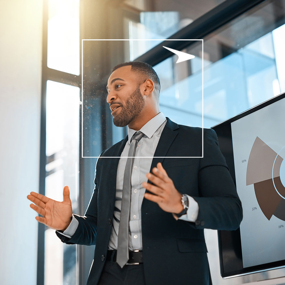 Man presenting data on tv screen