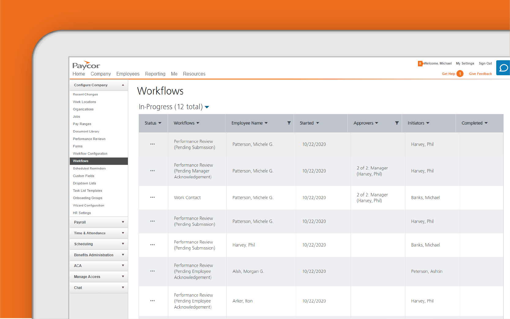 Corner of. tablet showing workflow dashboard against orange background