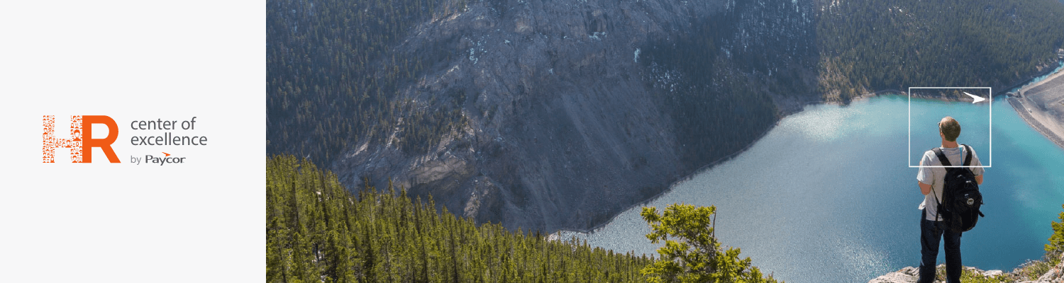 HR center of excellence logo next to man standing on a cliff overlooking trees and water