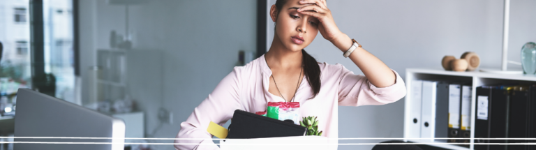 woman-with-hand-on-head-at-work