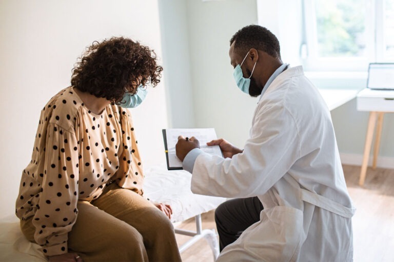 Doctor showing patient document