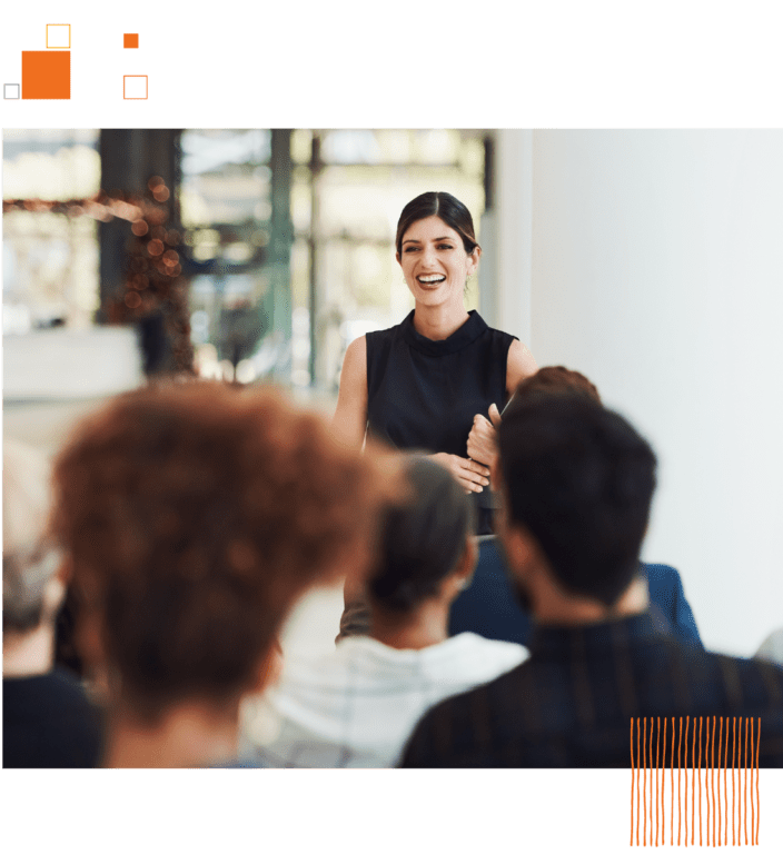 Woman speaking in front of crowd