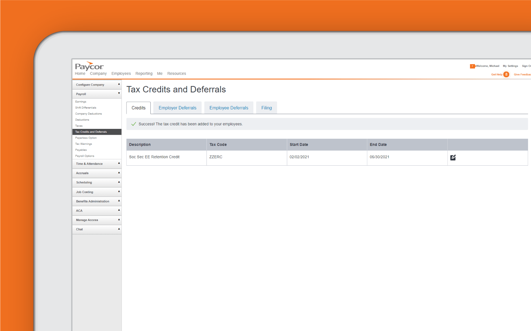 Corner of tablet showing tax credit dashboard against orange background
