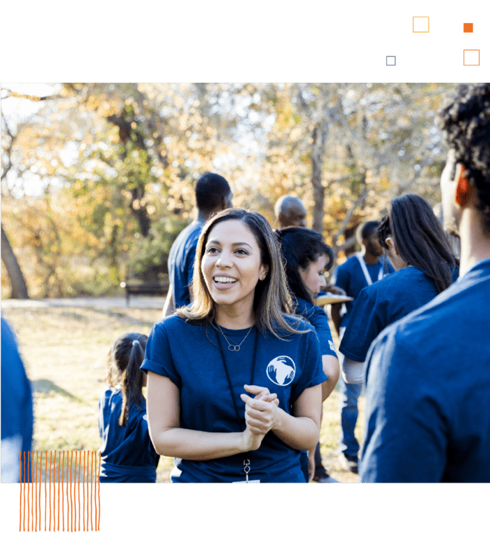 Woman in front of group of volunteers