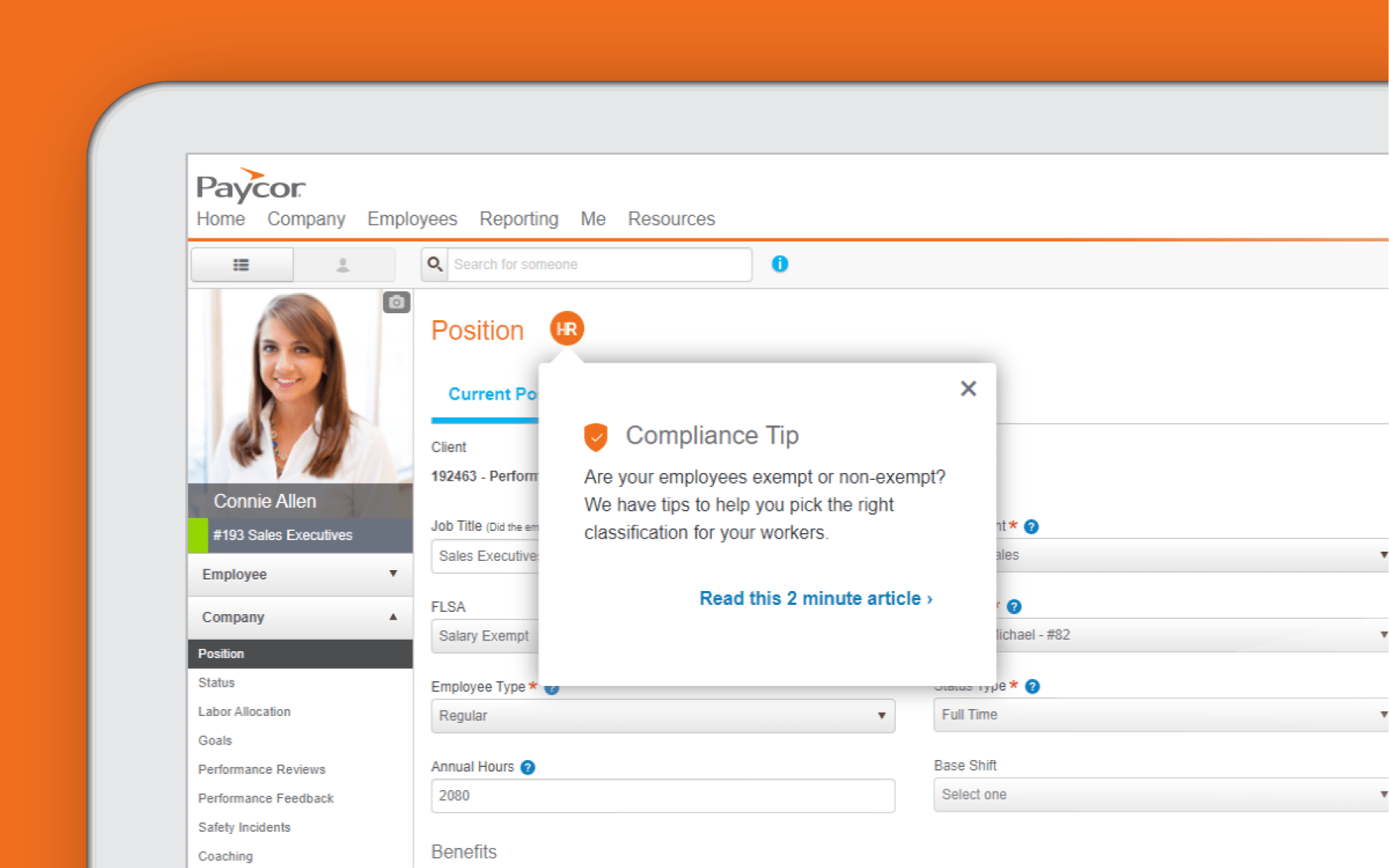 Corner of tablet showing compliance and reporting dashboard against orange background