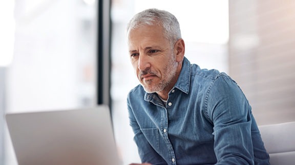 man reading documents