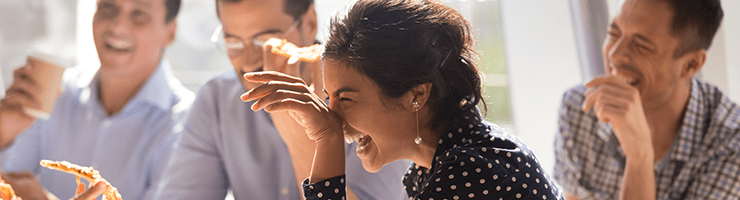 woman laughing with coworkers