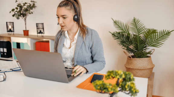 woman-in-headset-working-on-a-computer