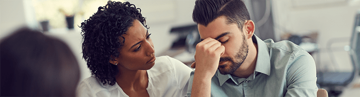 woman comforting man having mental breakdown