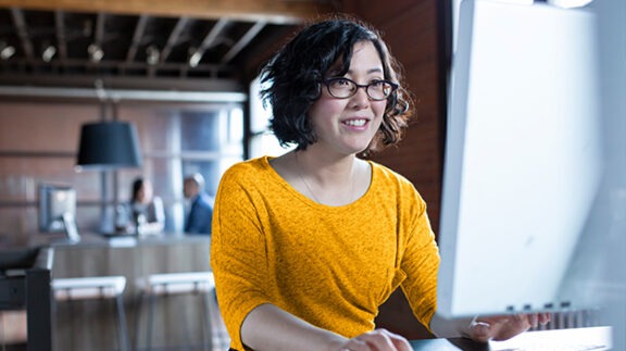 woman sitting in front of computer