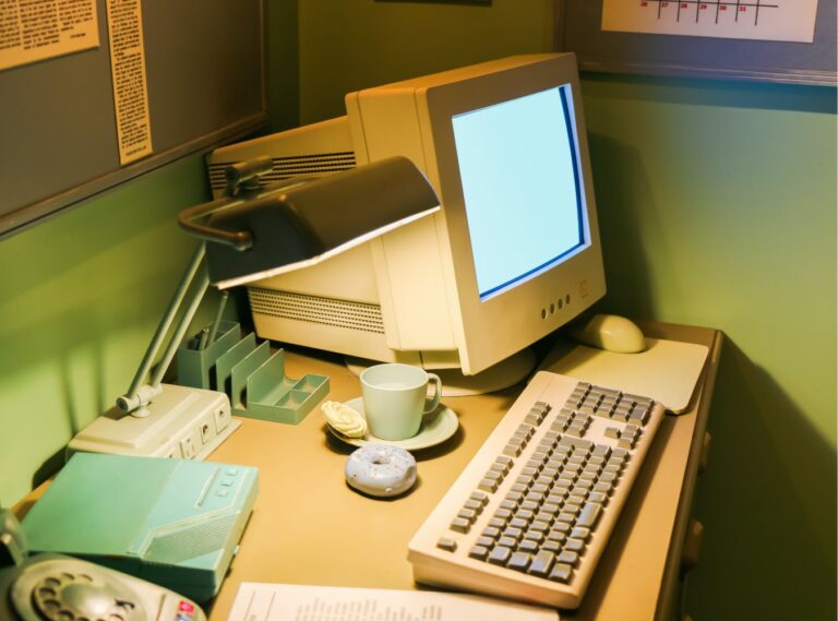 Old computer sitting on desk
