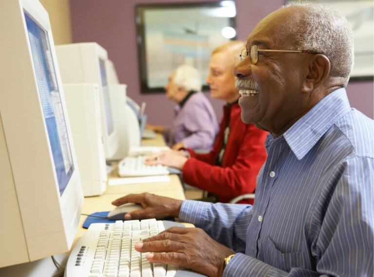 Man working on old computer in computer center