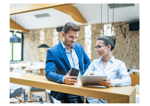 man and women looking at computer