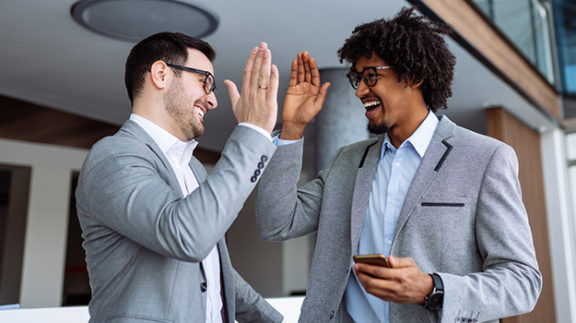 employees giving high five showing appreciation