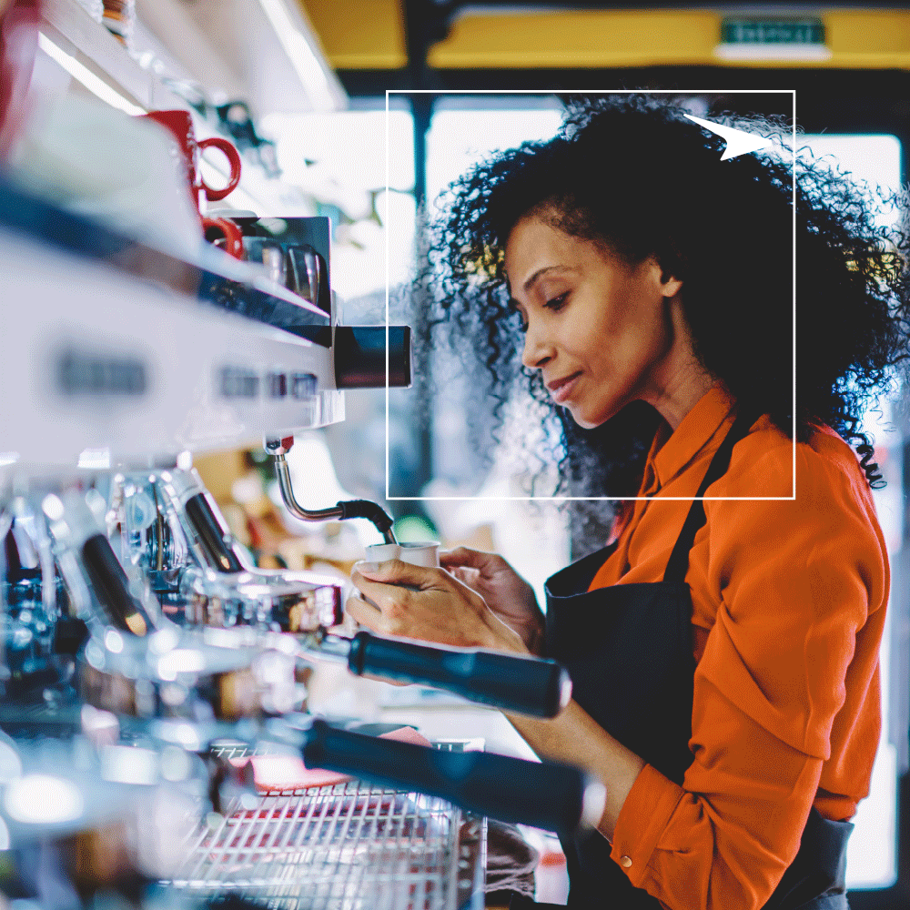 woman barista making coffee