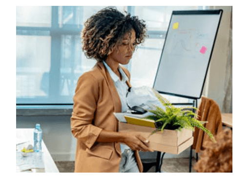 person holding box of desk items