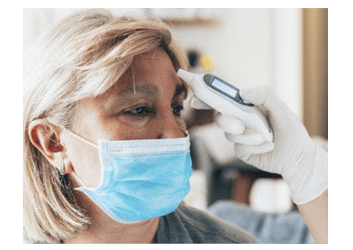 woman getting temperature taken while wearing mask