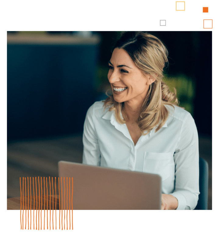 woman in a white shirt in front of a lap top