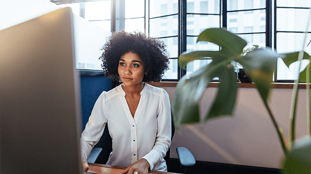 Lady working on ACA filings on computer