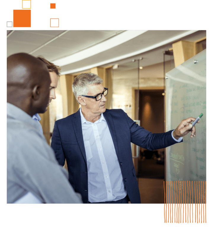 professional man showing information on a whiteboard