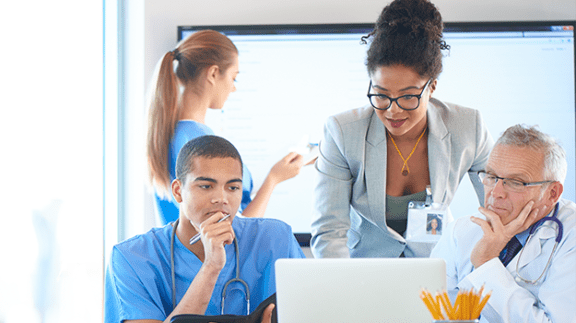 doctors looking at a computer