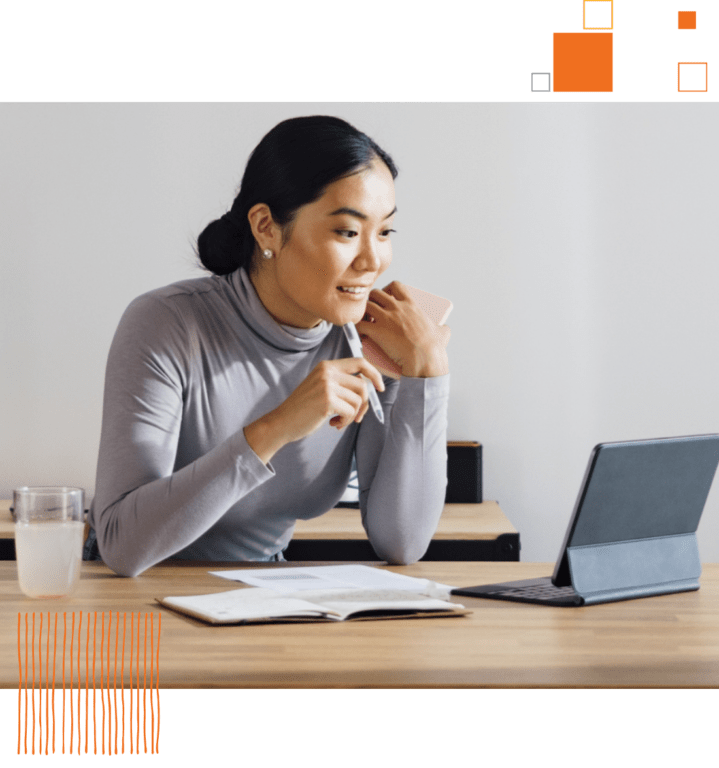 woman looking at tablet screen