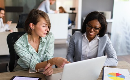 People in the office discussing business strategy