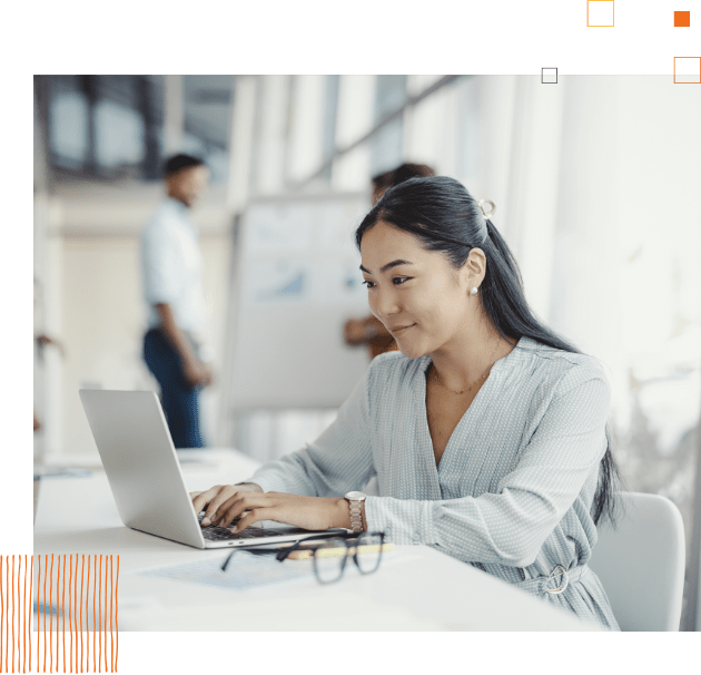 woman sitting at table with laptop