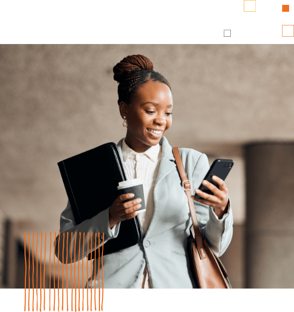 woman holding portfolio and coffee, looking at phone