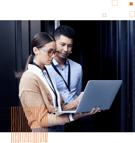 two people looking at laptop screen