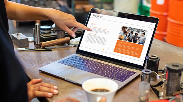 person pointing to laptop screen