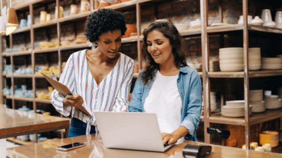 two-people-looking-at-laptop