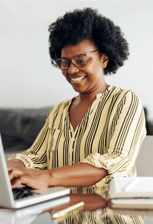 smiling woman using computer