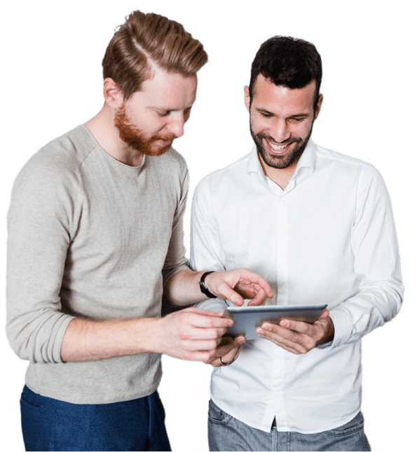 Two people looking at a tablet