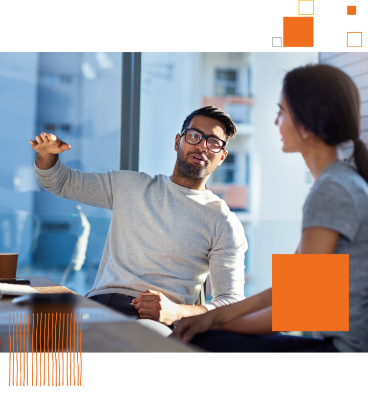 man and woman sitting in office