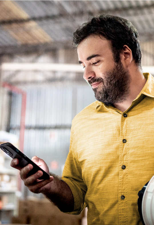 man looking at mobile phone