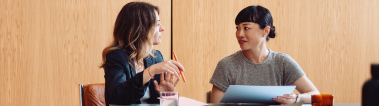 employees discussing work performance appraisal