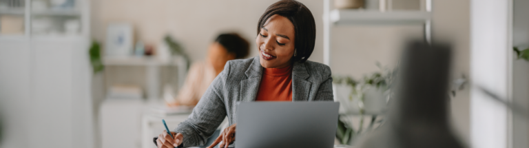 employer writing a performance appraisal for employee performance