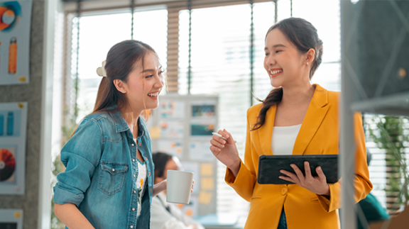 two employees discussing a performance improvement plan