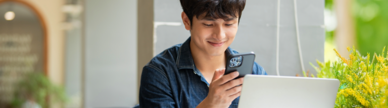 employee looking at phone demontrating time theft