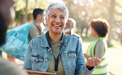 woman smiling and holding clipboard