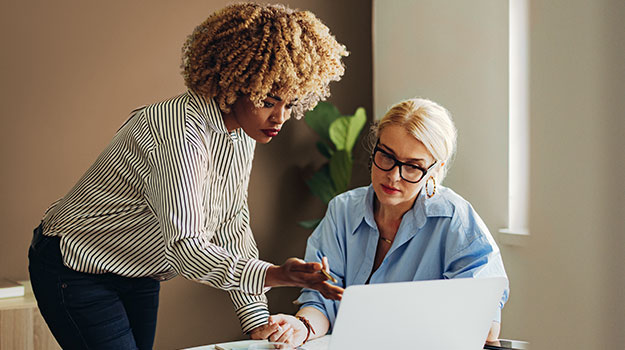 two employees researching state income tax rates