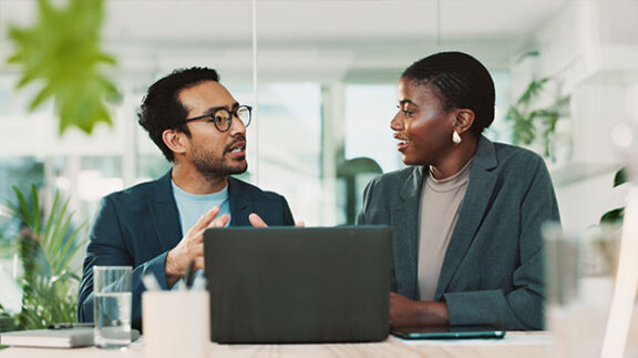 two employees discussing professional development
