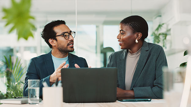 two employees discussing professional development