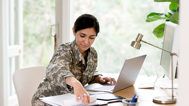 a hired veteran working on a computer