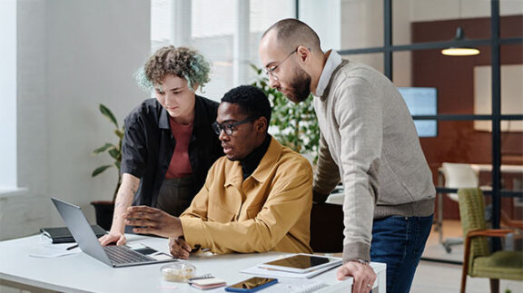 hr professionals looking at hr analytics data