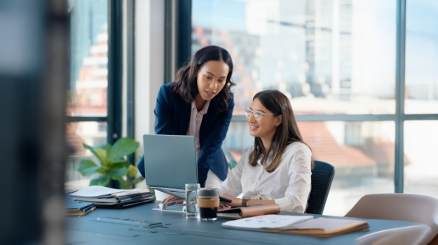 employees discussing areas of professional development and growth