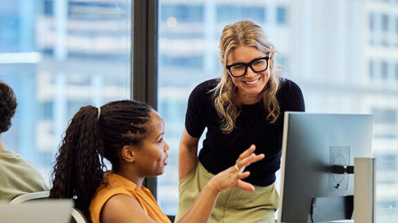 two employee completing a payroll audit