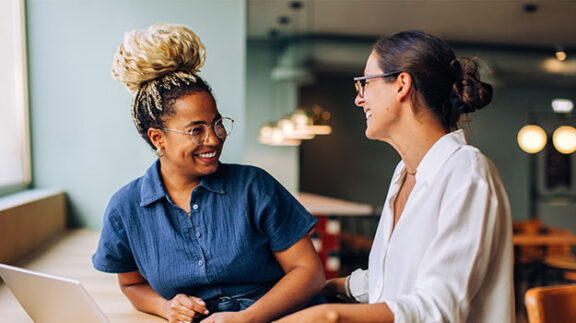 emplyees discussing payroll compliance